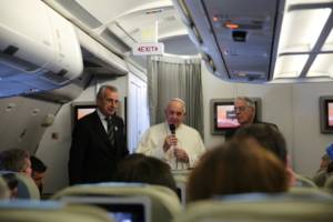 Pope Francis on an airplane